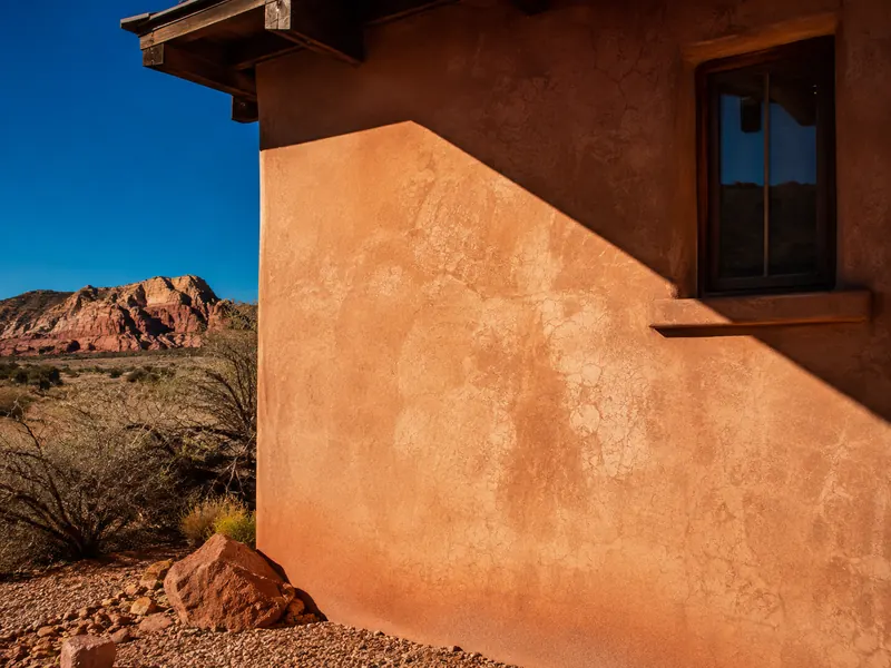 Sun-lit stucco wall on a St. George home, ready for a free written estimate