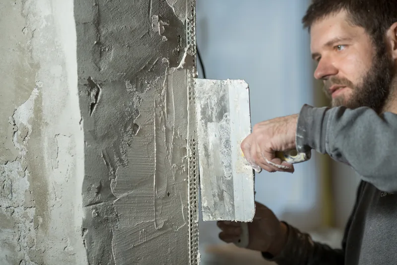 Corner bead set on an interior corner before plaster is applied